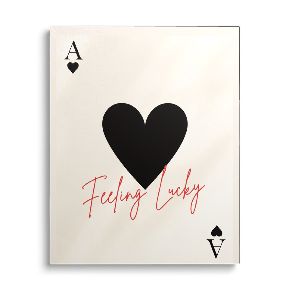 Toile Feeling Lucky vue de face sur fond blanc : carte à jouer as de cœur, grand cœur noir et inscription manuscrite rouge « Feeling lucky » sur fond crème