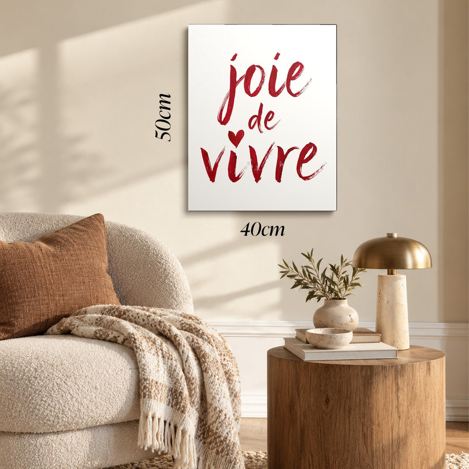 Toile Joie de Vivre accrochée dans un salon au-dessus d’un canapé, avec ses cotes 40 × 50 cm