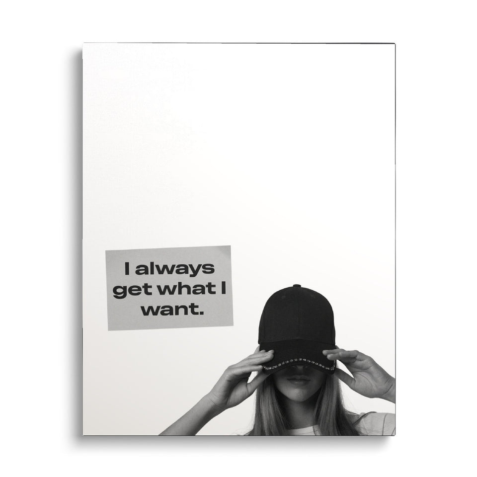 Toile What I Want vue de face sur fond blanc : photographie noir et blanc d’une femme ajustant sa casquette, avec un carton « I always get what I want. »